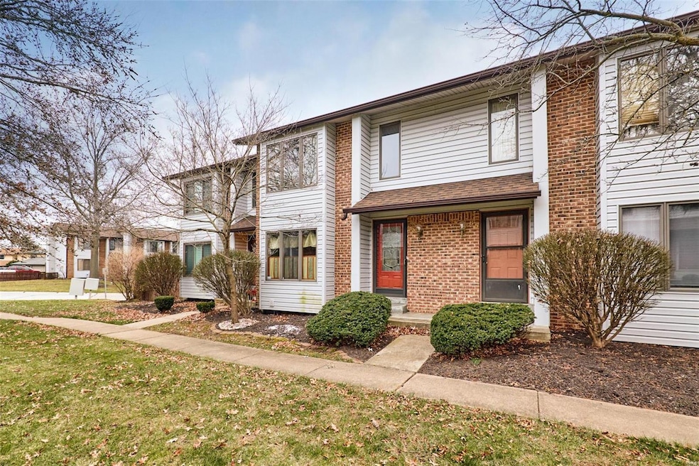 Front Elevation with Vinyl Siding and Brick Facade