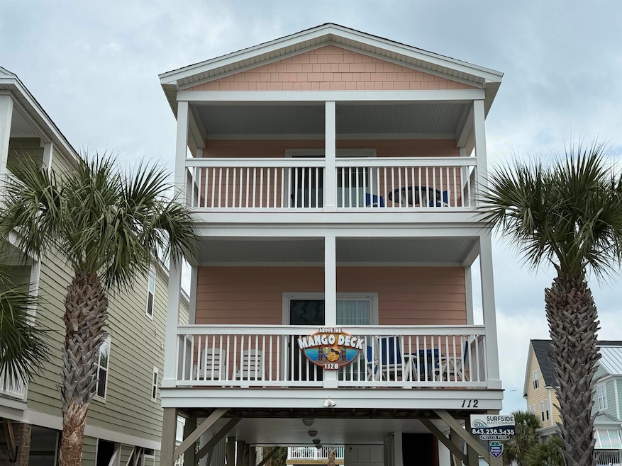 View of front of property featuring a balcony and 