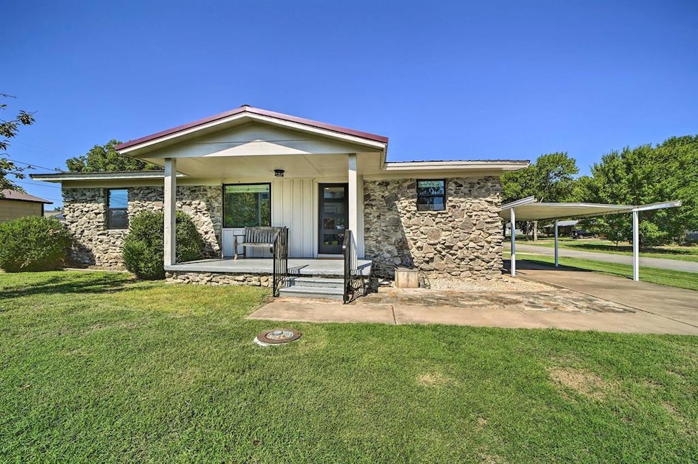Bungalow-style home featuring a porch, a front law