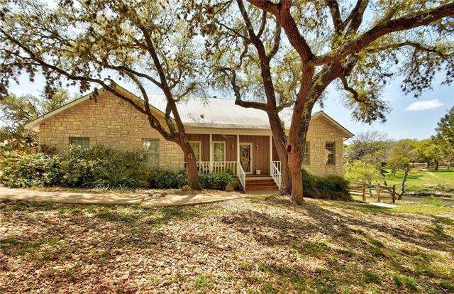 Beautifully landscaped and wooded lot in the front