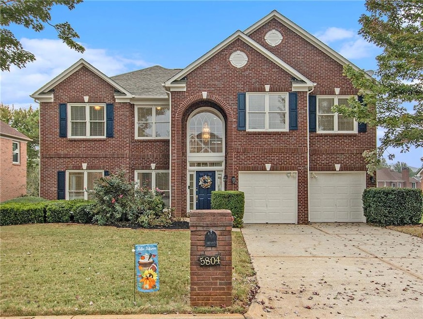 View of front of property featuring a garage and a