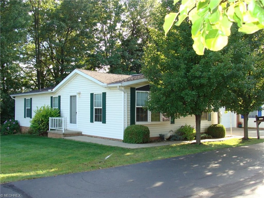 front of property vacant lot to the left