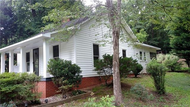 Covered front porch surrounded with Azelia bushes 