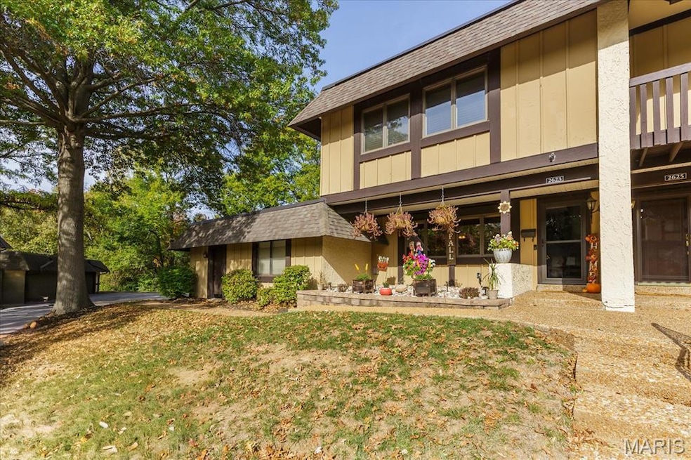 Rear view of house with roof with shingles and a yard