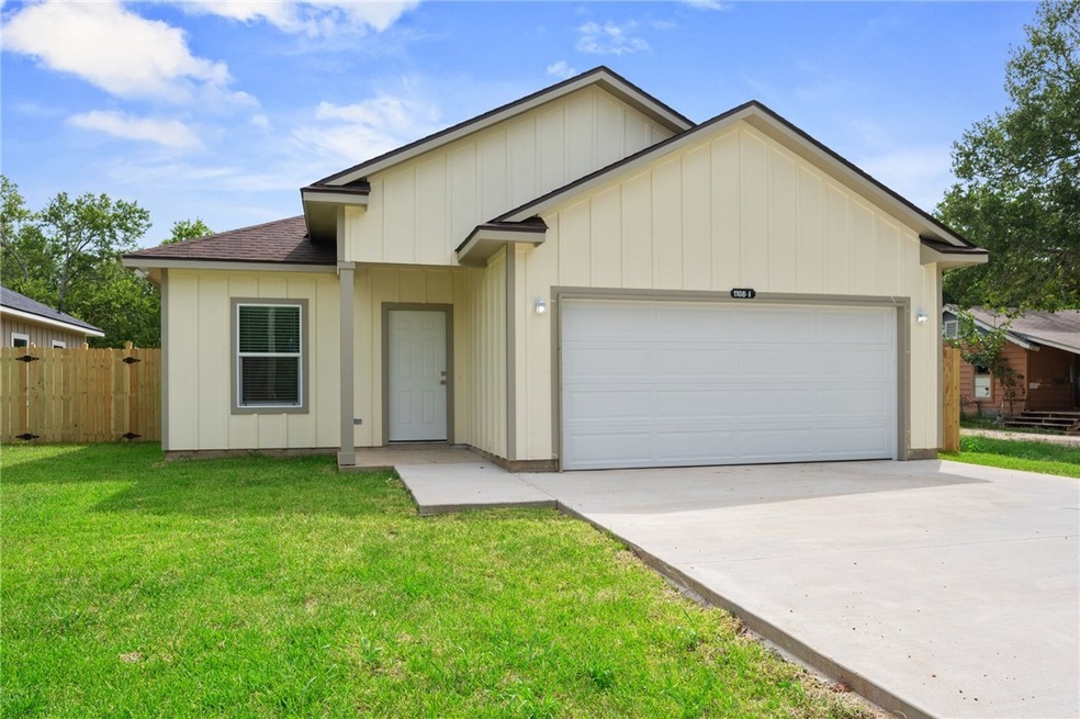 Ranch-style house with a garage, concrete driveway