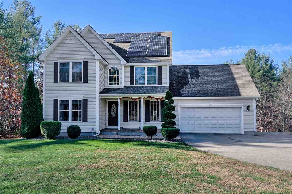 Front view includes two car garage and electric so