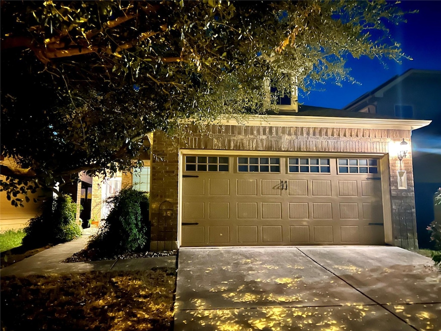 Garage at twilight with driveway