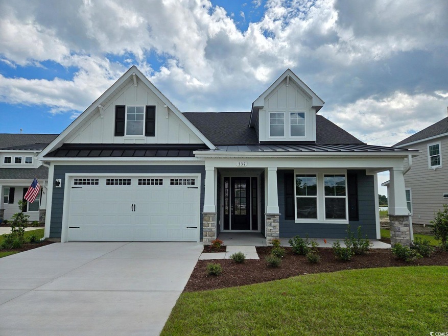 Craftsman inspired home with a garage, a front law