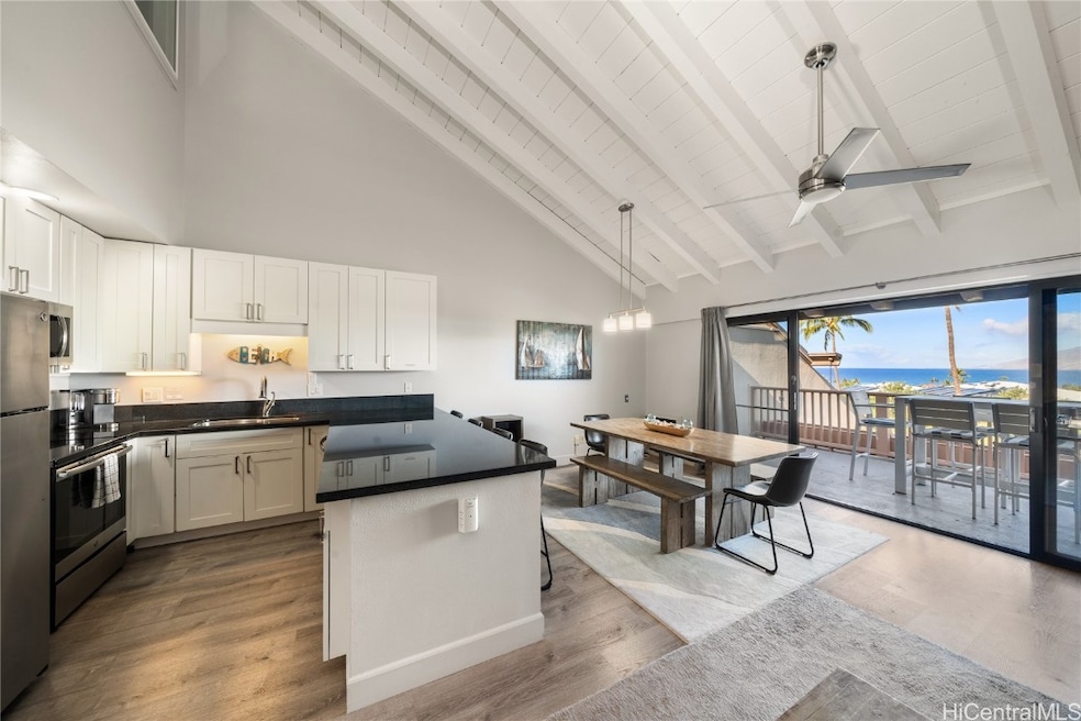 Large open concept living area with vaulted ceilin