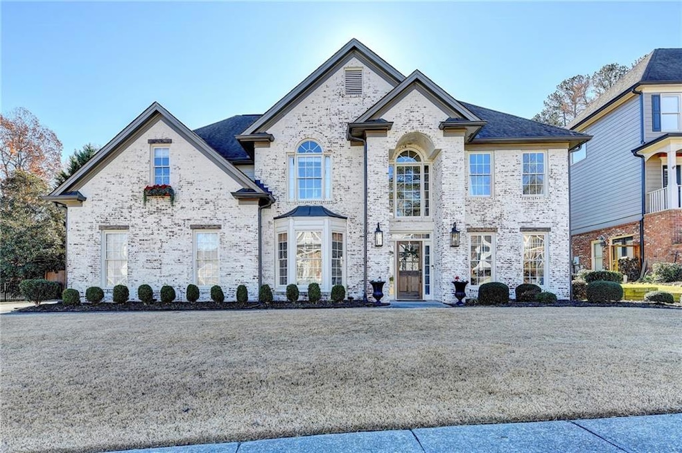 French country inspired facade featuring brick sid