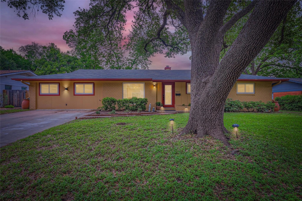 Single story home with brick siding, concrete dri