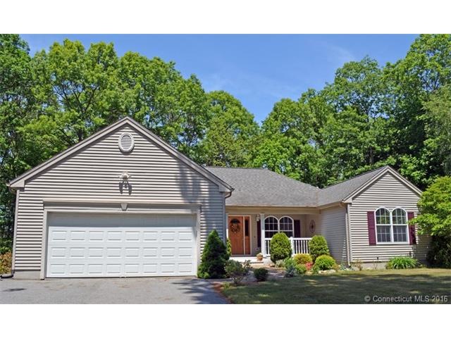 Professionally landscaped gardens adorn the front 