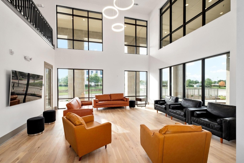 Living room with a towering ceiling and light hard