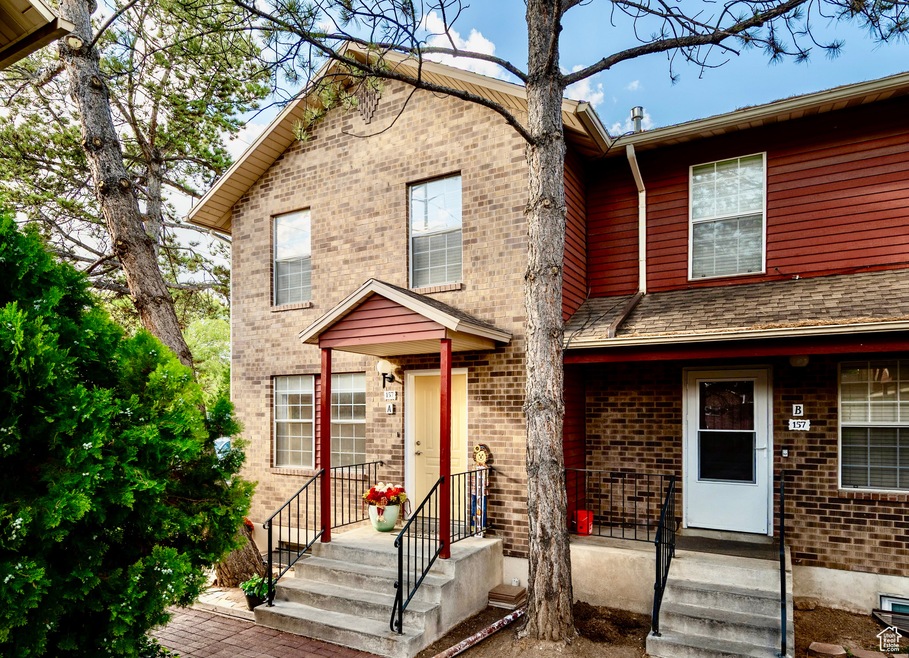 View of front of home featuring brick siding