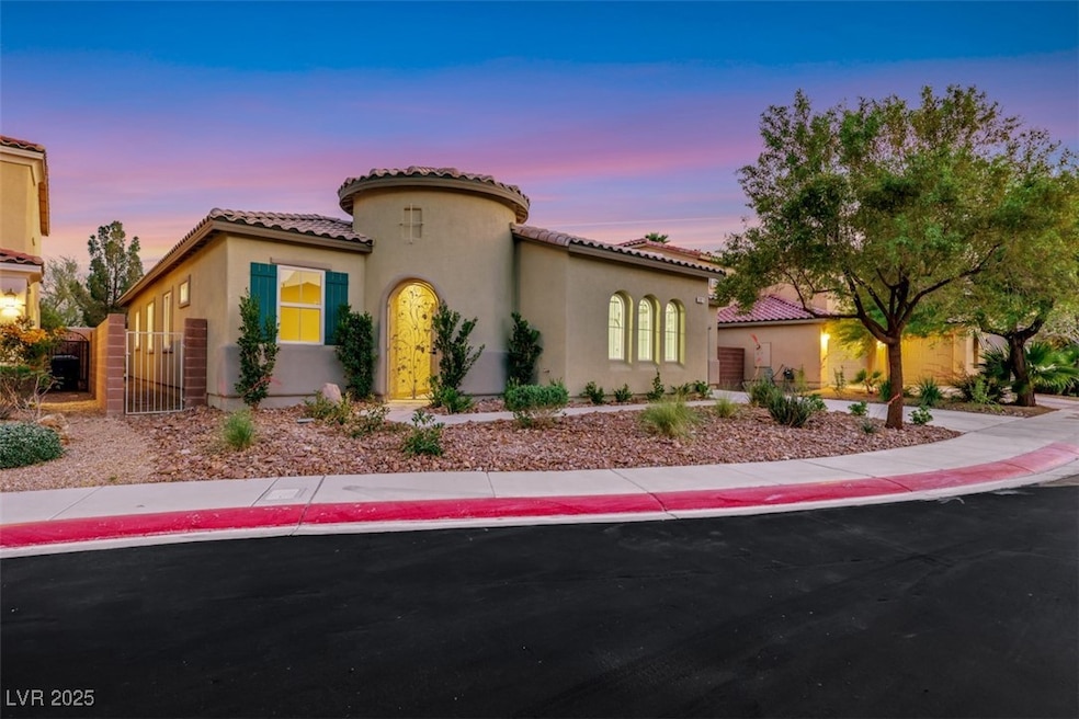Mediterranean / spanish-style house featuring a ga