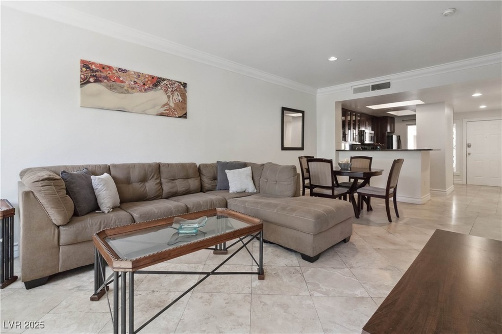 Living room with ornamental molding, recessed ligh