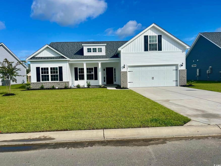 View of front facade featuring a garage and a fron