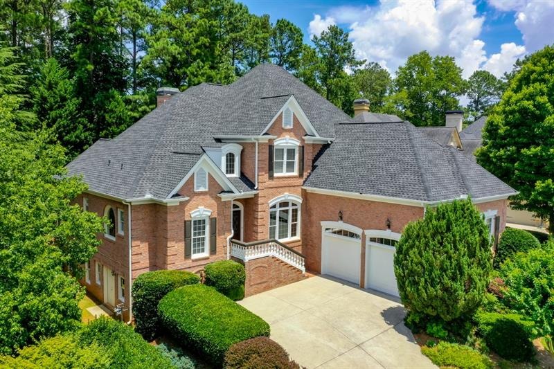 Stately 4 side brick custom home on street of mill