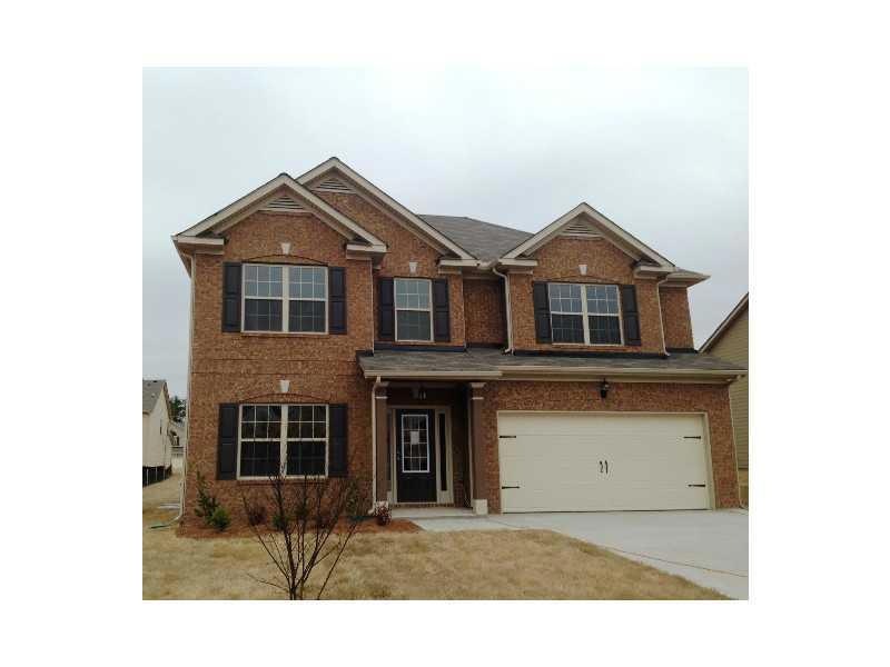 Exterior Front. Full brick front with two car carr