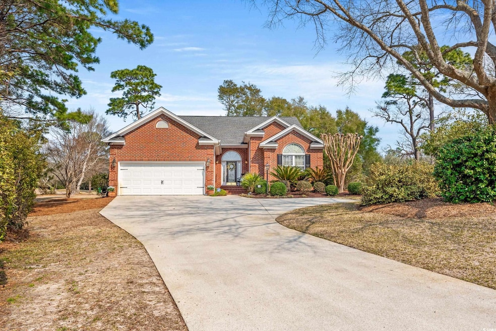 View of front of property featuring concrete drive