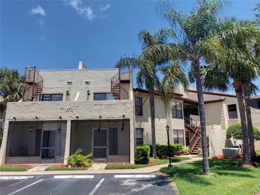 Front of the condo with assigned parking spot.