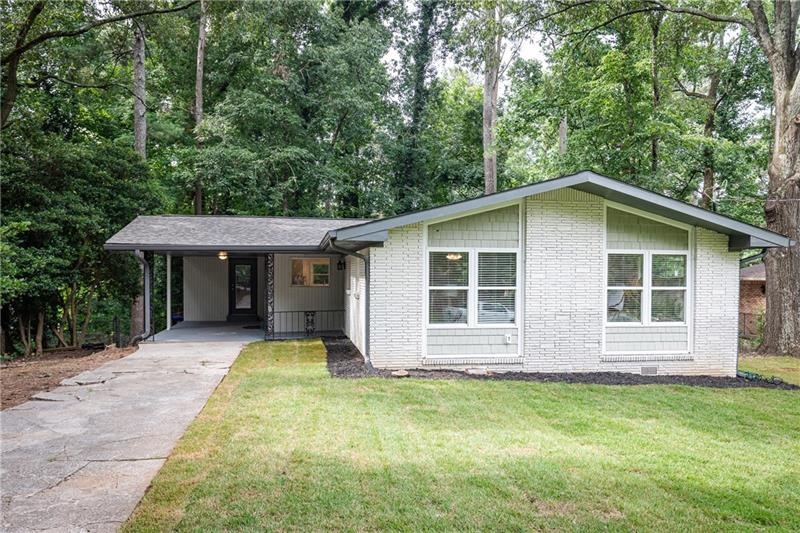 Welcome home to this charming painted brick ranch!