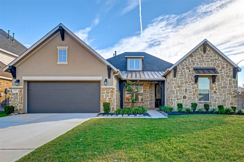 Beautiful contemporary stone exterior with designer landscape