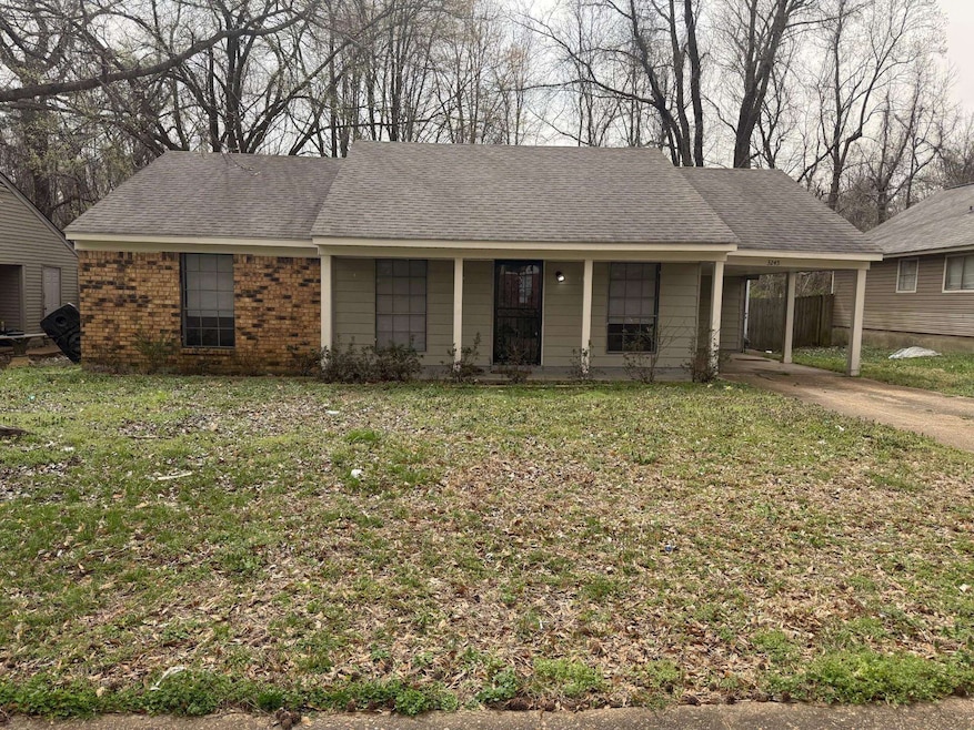 Single story home featuring concrete driveway, roo