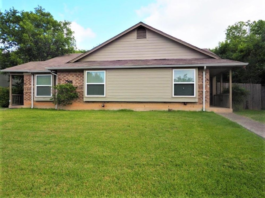 View of front of house with brick siding, a front