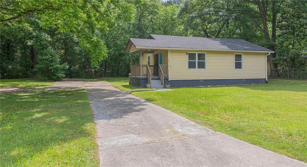 View of front of home with crawl space, a shingled roof, driveway, and a porch