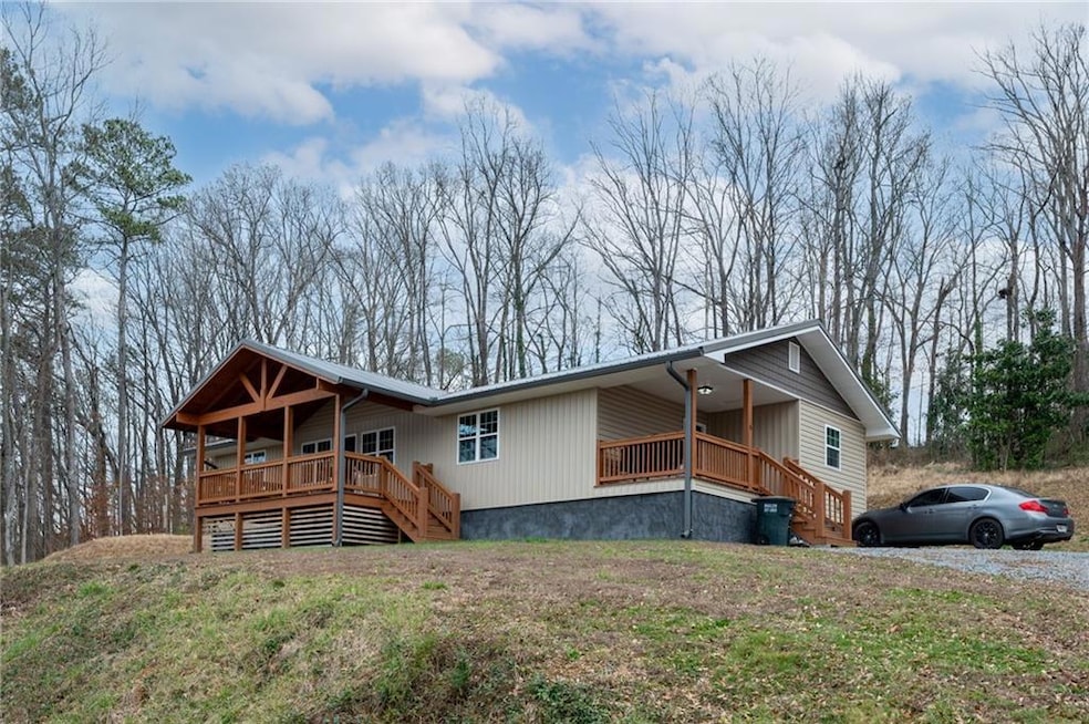 View of front of home with a front lawn and a wood