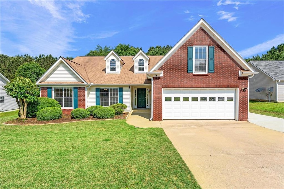 Traditional-style home with an attached garage, co