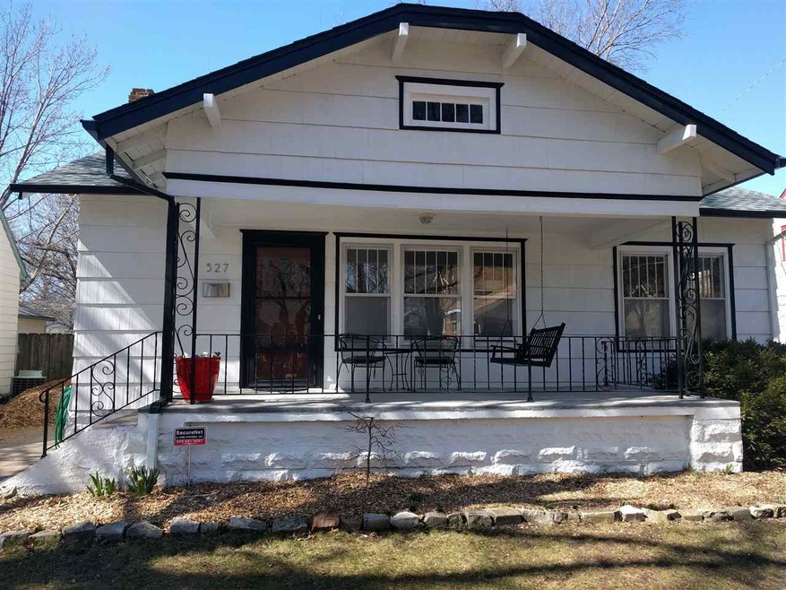Swing to relax on this large front porch!