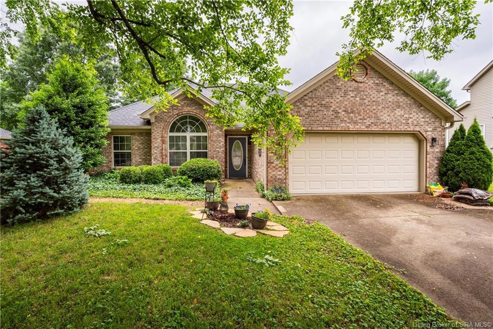 Brick ranch with beautful Blue Spruce