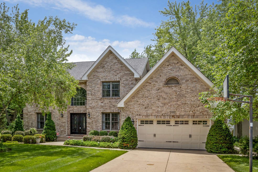 This nearly 3,000 sf home sits on a quarter acre l