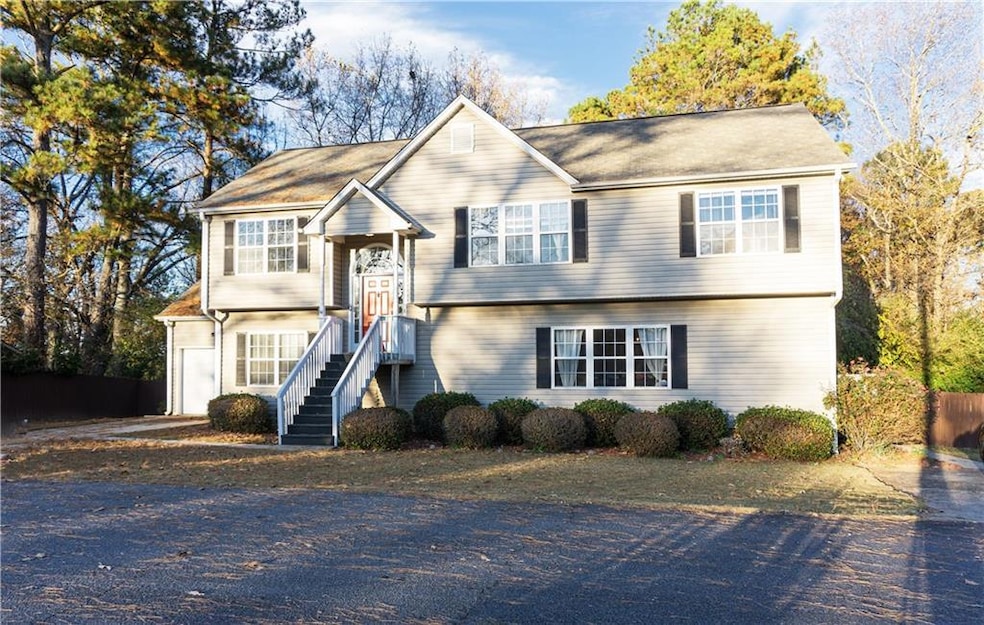 Split foyer home featuring driveway