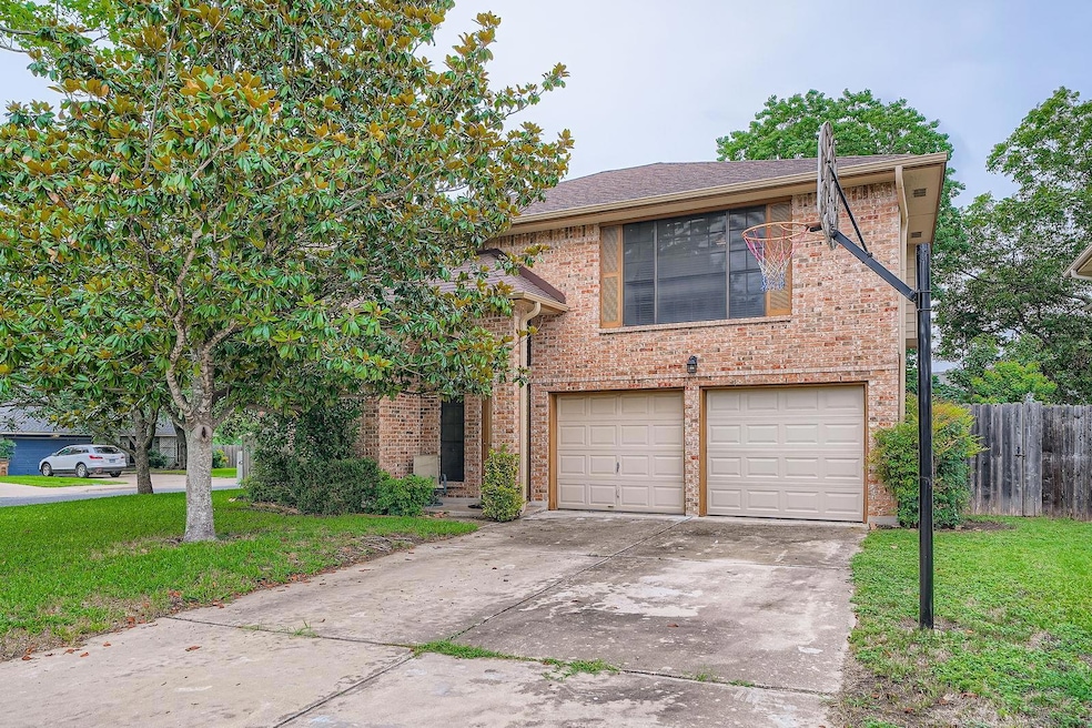 View of front of house with an attached garage, b
