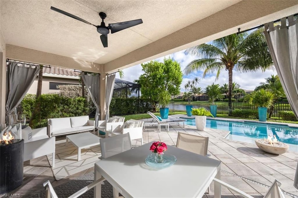 Fenced backyard with a patio, a ceiling fan, an outdoor living space with a fire pit, and outdoor dining area