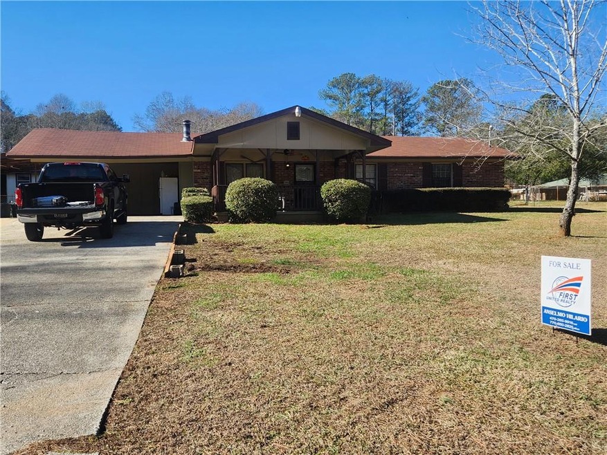 Ranch-style home featuring a front yard
