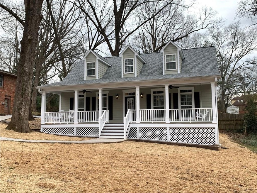 Cape cod-style house featuring a porch