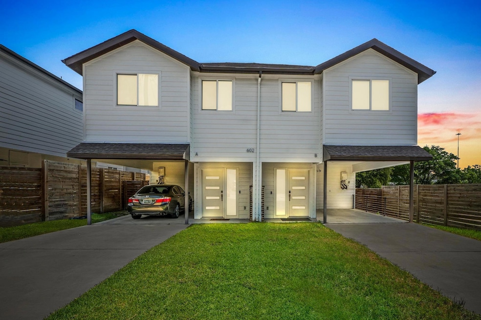 View of front of home with a carport, concrete dr