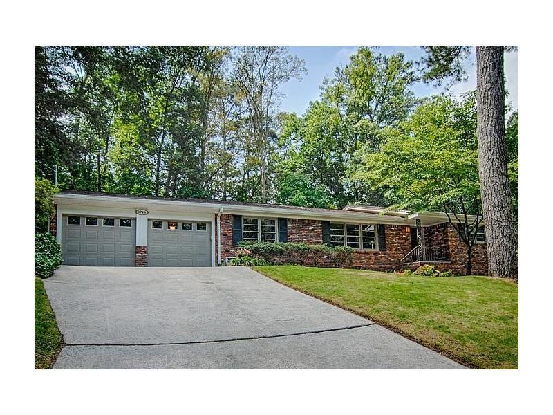 This 4-sided brick ranch home with finished baseme