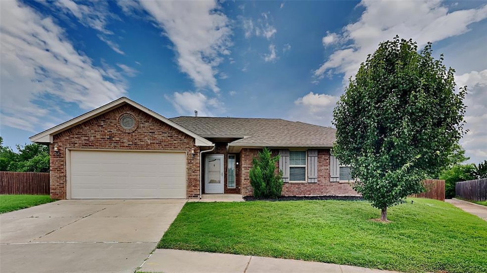 Ranch-style house featuring brick siding, concrete