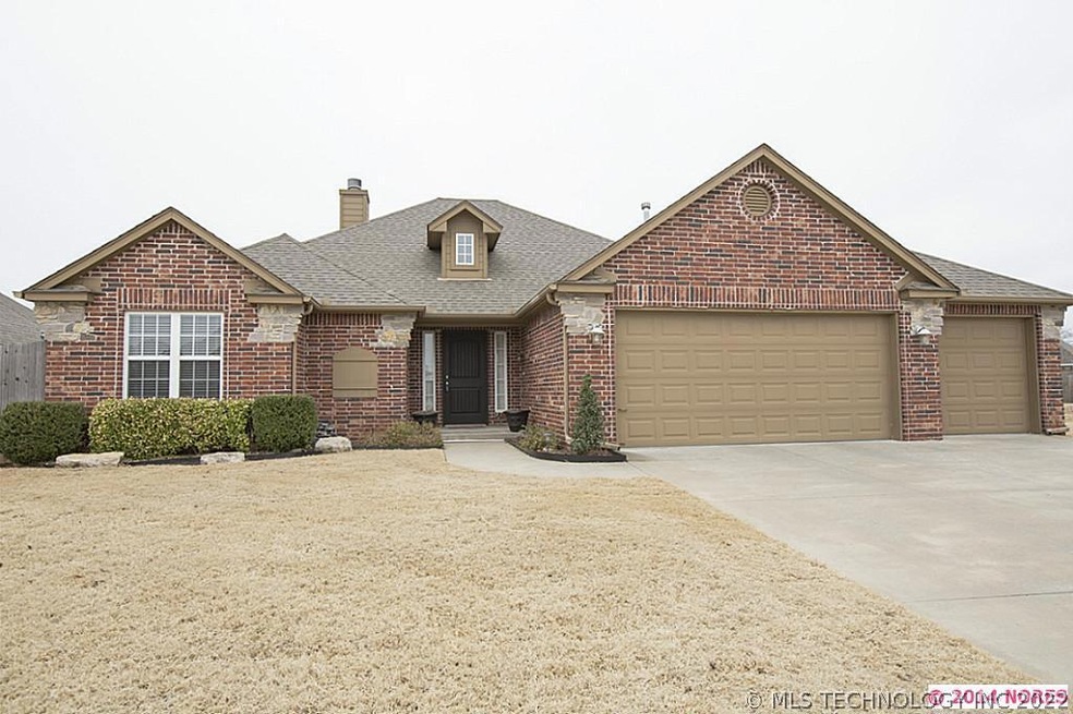 Fabulous full brick with stone accents. 3 car gara