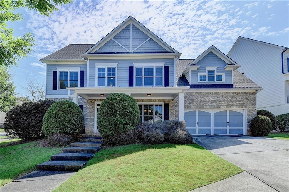 Craftsman inspired home featuring a garage and a f