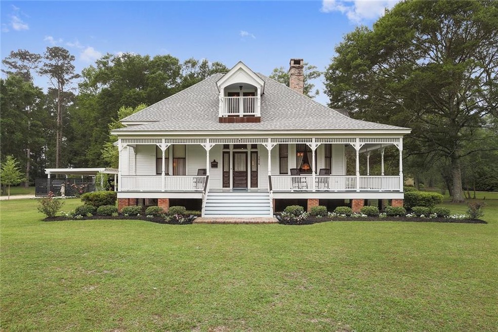 Front elevation showing beautifully landscaped ent