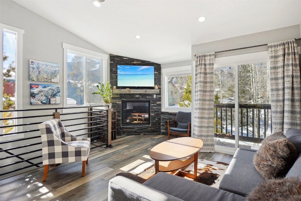 Living room featuring recessed lighting, vaulted c