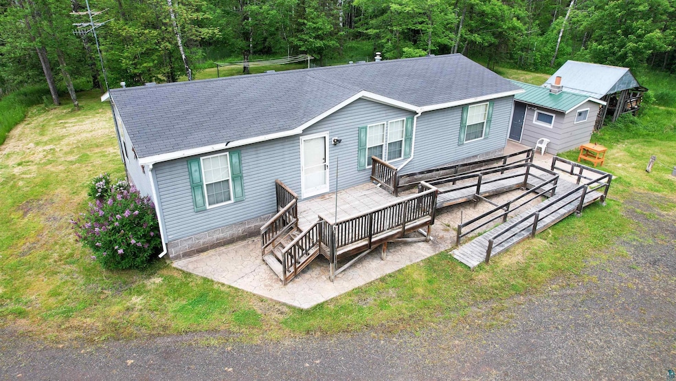 View of front of house with a wooden deck