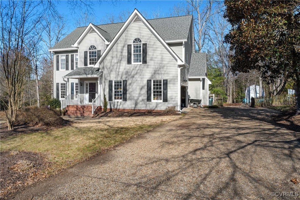 View of front of property with aphalt driveway and