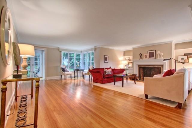 Upon entering this stunning living room, one is gr